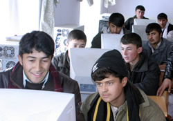 photo, Afghan students enjoying their studies using computers