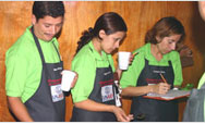 Ingrid Cornejo and fellow graduates demonstrate their skills as junior cuppers, at the USAID-financed coffee cooperative laboratory in Jinotega, Nicaragua - Click to read this story