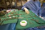 A scrub technician with surgical instruments is seen in this undated handout photo. REUTERS/Newscom/Handout