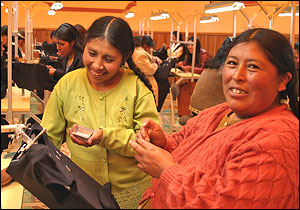 photo, Embroiderers from a small business in Bolivia work to meet their export orders