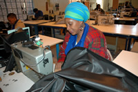 photo - seamtress working at sewing machine
