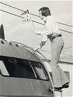 Photo of John Nelson attaching a microwave antenna to EPA's radiation analysis van