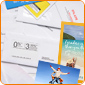 pile of direct mail pieces in different formats