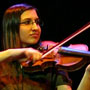 Photo of Liz Chibucos from The Student Loan playing the violin.