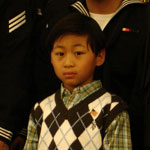 Martin Miles Ulsano, age 7, first child naturalized as a U.S. citizen overseas