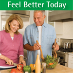 Woman and man cooking, chopping vegetables