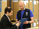 WHO staff prepare boxes of antiviral drugs for dispatch to countries.