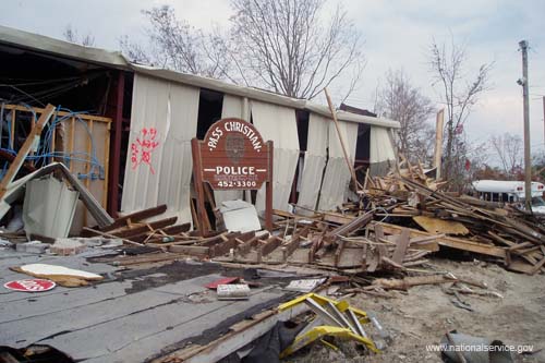 Crumpled metal and scattered debris are all that remains of the police station in Pass Christian, Miss.