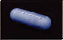 Photograph of a powder-blue capsule.