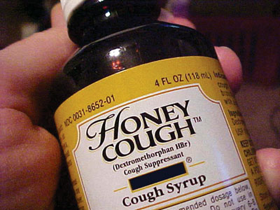 Photo of Honey Cough™ cough syrup bottle showing Dextromethorphan HBr on the front label.