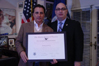 USCIS Director Emilio T. González presents Andy Garcia with the "Outstanding American by Choice" recognition in Los Angeles, CA, Jan. 24, 2008
