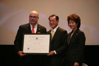From left to right: USCIS Director Emilio T. González, Dr. James S.C. Chao, and Secretary Elaine L. Chao as Dr. Chao is presented with the, "Outstanding American by Choice" recognition in New York, NY, Feb. 27, 2008