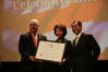 From left to right: USCIS Director Emilio T. González, Secretary Elaine L. Chao, and Dr. James S.C. Chao as Secretary Chao is presented with the, "Outstanding American by Choice" recognition in New York, NY, Feb. 27, 2008