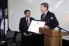 USCIS Acting Director Jock Scharfen presents Dr. Abul Hussam with the “Outstanding American by Choice” recognition at George Mason University in Fairfax, VA, Oct. 21, 2008