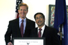 Dr. Abul Hussam accepts the “Outstanding American by Choice” recognition from USCIS Acting Director Jock Scharfen at George Mason University in Fairfax, VA, Oct. 21, 2008