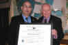 USCIS Director Emilio González and U.S. Representative Tom Lantos (CA-12) with the “Outstanding American by Choice” recognition in Washington, DC, Mar. 9, 2006