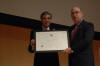 USCIS Director Emilio T. González presents Commerce Secretary Carlos M. Gutierrez with the “Outstanding American by Choice” recognition in Philadelphia, PA, May 15, 2006