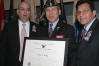 From left to right: USCIS Director Emilio T. González, "Outstanding American by Choice" recipient Fang A. Wong, and Attorney General Alberto Gonzales in New York, NY, Jul. 7, 2006