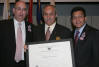 From left to right: USCIS Director Emilio T. González, "Outstanding American by Choice" recipient Dr. Guillermo Linares, and Attorney General Alberto Gonzales in New York, NY, Jul. 7, 2006
