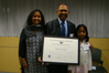 Subir Chowdhury accepts the “Outstanding American by Choice” recognition and is pictured with his wife, Malini, and daughter, Anandi, in Detroit, MI, Apr. 29, 2009