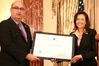 USCIS Director Emilio T. González presents Assistant Secretary of State Dina Powell with the “Outstanding American by Choice” recognition in Washington, DC, Apr. 23, 2007