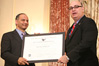 USCIS Director Emilio T. González presents Farooq Kathwari with the “Outstanding American by Choice” recognition in Washington, DC, Apr. 23, 2007