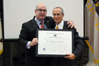 Dr. Samuel Saldívar accepts the “Outstanding American by Choice” recognition from USCIS Director Emilio T. González in West Point, NY, May 17, 2007