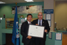 USCIS Director Emilio T. González recognizes Tze Ng as an "Outstanding American by Choice" in Providence, RI, Nov. 1, 2007