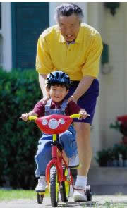 Grandfather and child on bike