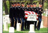 Old guard casket team bears flag draped coffin at ANC.