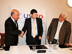 
CAPTION:	From left: Mehmet Henefi Toremis (Turkish Electricity Transmission Corporation), Sulkhan Zumburidze (Georgia State Electrosystem), and Marlen Askerov (AzerEnergy) shake hands after signing an MOU to create the Power Bridge Project. 
