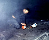Miner donning a self-contained self-rescuer