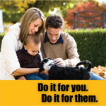 Young couple with toddler enjoy puppy and outdoors