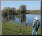 Rancher looking at his ranch