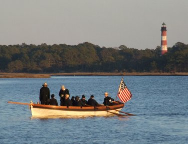 This picture shows a sounding vessel with oars--how it would have looked in 1807.  The vessel is several hundred yards from shore with a lighthouse in the background.