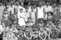 Photo of a large group of Bangladeshi men and boys.