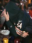 A Chicago Bears fan reacts in the closing seconds while watching his team's 29-17 loss to the Indianapolis Colts in Super Bowl XLI in Chicago February 4, 2007. REUTERS/Frank Polich