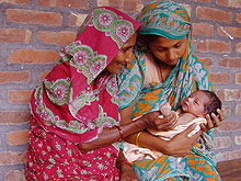 Photo of a grandmother and adolescent mother with the first child born in the MINIMAT study cohort in Matlab, Bangladesh. Four thousand mothers were followed through their pregnancies with nutritional interventions to prevent low birth weight.