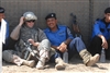 Senior Airman Miller relaxes with a group of Iraqi policemen.
