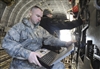 Staff Sgt. Carl Wesley reviews procedures for opening an aircraft ramp.