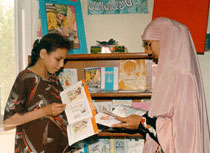 Photo of two women reading books in Egypt.