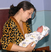 Inga Marusceac with her newborn daughter Tatiana at the renovated maternity ward in Telenesti, Moldova.