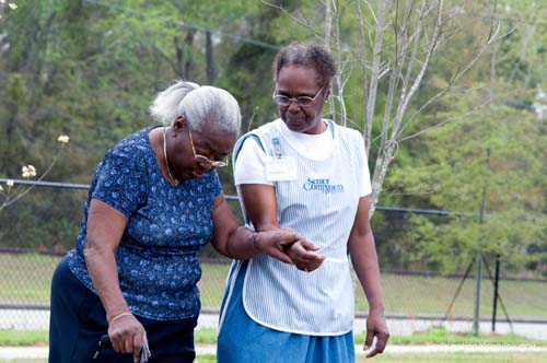 On April 1, 2008, Senior Companion Euphina Irvin takes a walk with client Costella Black outside her home in North Charleston, South Carolina.