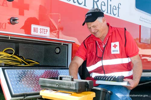 On April 2, 2008, RSVP Disaster Relief Volunteer, Patrick Bos, does routine supply checks at the American Red Cross base in Charleston, South Carolina.