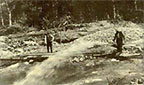 Water just starting to flow through a hydraulic giant.  Lee Creek, 1913.