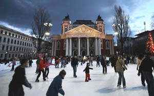 People ice skate in front of the National Theatre, Sofia, Bulgaria, January 2, 2006. [© AP Images]
