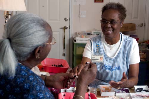On April 1, 2008, Senior Companion Euphina Irvin spends time with client Costella Black in her home in North Charleston, South Carolina.