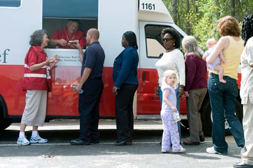 On April 2, 2008, RSVP Disaster Relief Volunteer, Patrick Bos, and his wife, Mary Bos, provide aid at a disaster site in Charleston, South Carolina.