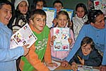 Children from the "Marshal Tito" elementary school in Ulcinj, Montenegro, holding the second issue of their magazine Djecja Planeta (Children's Planet), 22 December 2008. (OSCE/Mia Lausevic)
			