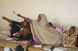 Somali students listen to a USAID-supported radio education program